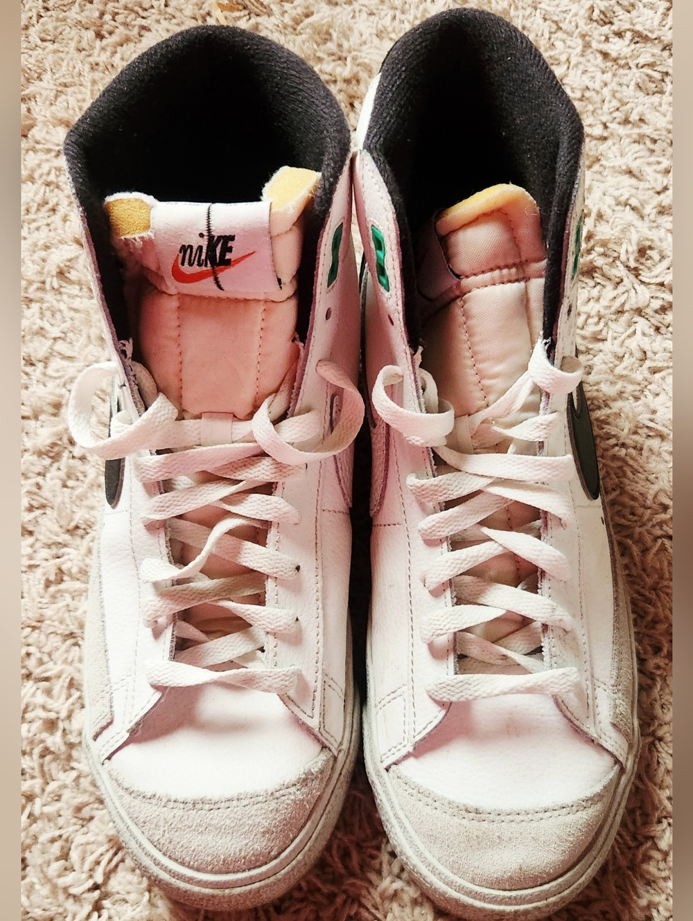 Nike White High-Top Sneakers with Black Swoosh and Green Eyelet